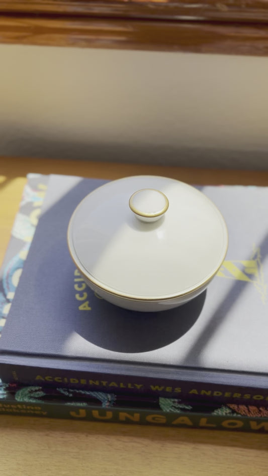 White dish with lid and gold rim